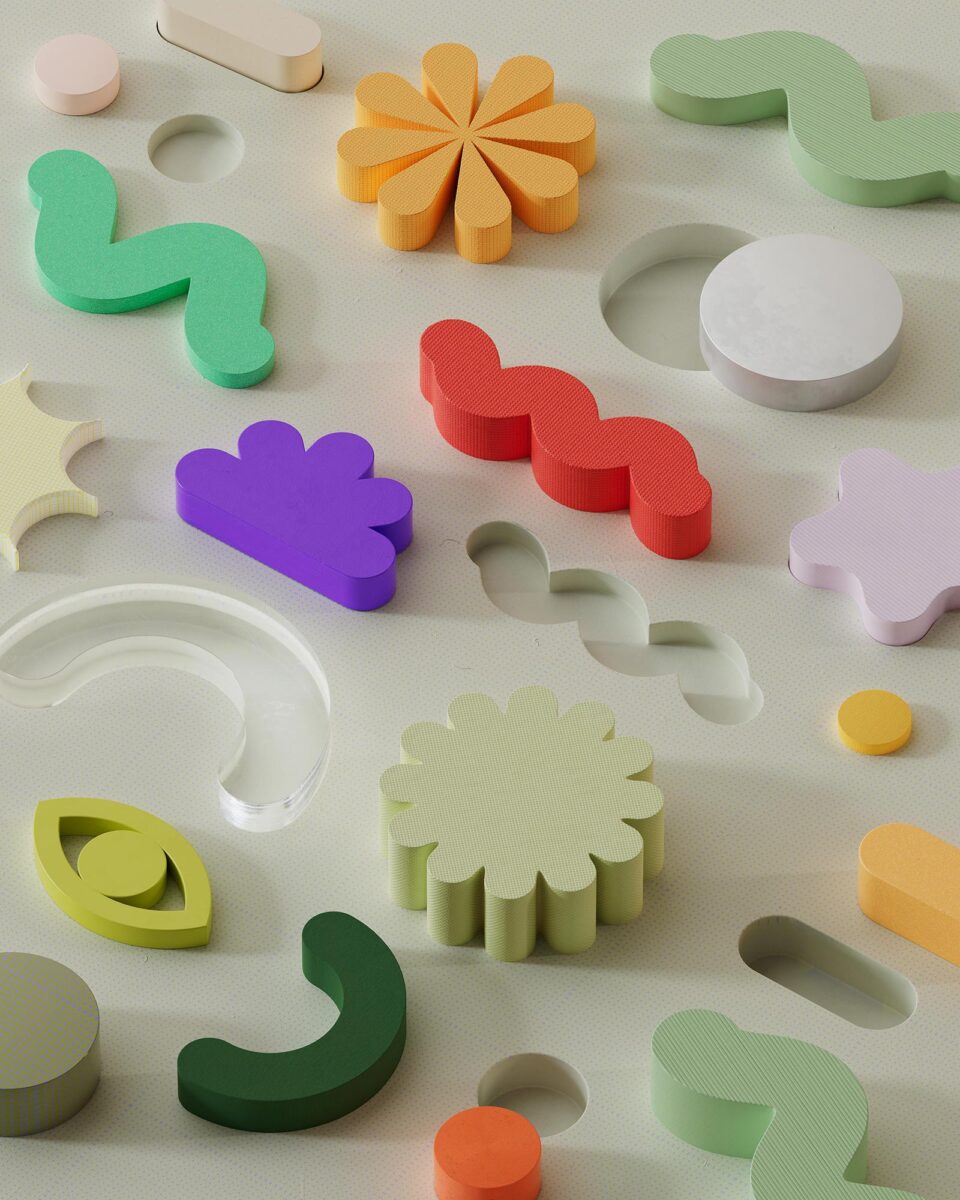 Colorful foam shapes, including squiggles, rainbows, and clouds