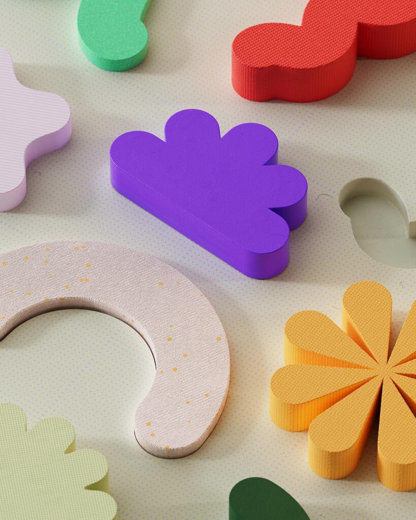 Chunky, colorful foam shapes including a daisy and a cloud