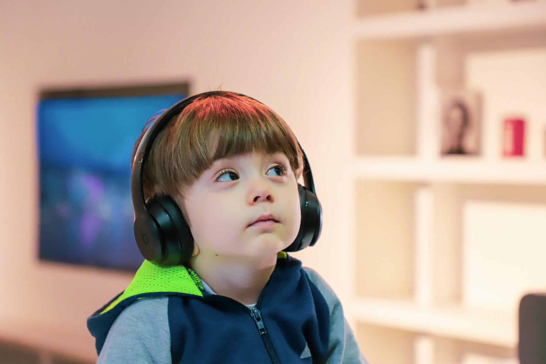Young boy wearing headphones.